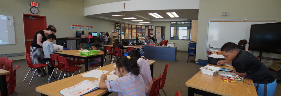 Male and female students working on computers and iPads in the Learning Commons areas